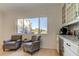 Cozy breakfast nook featuring seating area with a view, plus a coffee bar with white cabinets at 1089 Virginia St, Dunedin, FL 34698
