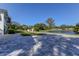 Paver driveway with a view of the lake at 1089 Virginia St, Dunedin, FL 34698