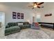 Comfortable game room with a plush sectional, air hockey table, and wall art at 1089 Virginia St, Dunedin, FL 34698