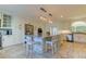Well-lit kitchen with a large island, white cabinetry, and stainless steel appliances at 1089 Virginia St, Dunedin, FL 34698