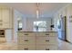 Bright kitchen showcasing a large island, stainless steel appliances, and custom cabinets at 1089 Virginia St, Dunedin, FL 34698