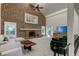 Bright and airy living room with a brick fireplace and comfortable seating at 1089 Virginia St, Dunedin, FL 34698