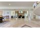 Open floor plan showcasing the fireplace, staircase, tile floors, and living spaces at 1089 Virginia St, Dunedin, FL 34698