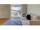 Bright living room with lake views, a comfortable sofa and a stylish round rug at 1089 Virginia St, Dunedin, FL 34698