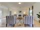 Cozy living room featuring stylish seating, a fireplace, and natural light at 1089 Virginia St, Dunedin, FL 34698