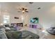 Spacious game room featuring a large sectional, media center, air hockey table, and ample natural light at 1089 Virginia St, Dunedin, FL 34698
