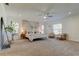 Spacious main bedroom with a decorative accent wall, ample natural light, and stylish furnishings at 1089 Virginia St, Dunedin, FL 34698