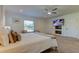 Comfortable main bedroom with a king bed, TV, and neutral decor at 1089 Virginia St, Dunedin, FL 34698