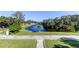 Beautiful exterior view of waterway with manicured green space at 1089 Virginia St, Dunedin, FL 34698