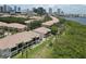 Aerial view of the complex showcasing its proximity to the waterfront, landscaping, and architectural design at 1111 Normandy Trace Rd # 1111, Tampa, FL 33602