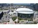 An aerial view of the arena, nearby highway, and surrounding cityscape against a blue sky at 1111 Normandy Trace Rd # 1111, Tampa, FL 33602