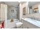 Well-lit bathroom with gray tiled shower/tub, white fixtures, and a vanity with a marble countertop at 1111 Normandy Trace Rd # 1111, Tampa, FL 33602