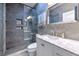 Modern bathroom featuring gray tile, a glass shower, and a white vanity with marble countertop at 1111 Normandy Trace Rd # 1111, Tampa, FL 33602