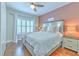 Cozy bedroom with a plush white bed, side tables, decorative pillows, and a window with shutters at 1111 Normandy Trace Rd # 1111, Tampa, FL 33602