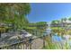 Outdoor deck overlooking a scenic pond with a fountain, perfect for relaxing and enjoying the peaceful surroundings at 1111 Normandy Trace Rd # 1111, Tampa, FL 33602