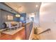 Dining area with stylish seating, modern light fixture, and hardwood floors, next to the downstairs staircase at 1111 Normandy Trace Rd # 1111, Tampa, FL 33602