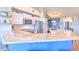 Modern kitchen with stone countertops, stainless steel appliances, and an open layout, dining area nearby at 1111 Normandy Trace Rd # 1111, Tampa, FL 33602