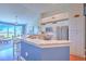 Stylish kitchen featuring marble countertops, stainless appliances, and a breakfast bar with seating at 1111 Normandy Trace Rd # 1111, Tampa, FL 33602