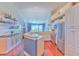 Bright, open kitchen with granite countertops, stainless steel appliances, and ample cabinet space at 1111 Normandy Trace Rd # 1111, Tampa, FL 33602