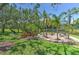 A lovely pond view with fountain, chairs, tables, and tropical landscaping to enjoy in the backyard at 1111 Normandy Trace Rd # 1111, Tampa, FL 33602
