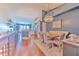 Open-concept living space showcasing a modern kitchen, dining area, and views from hardwood floors at 1111 Normandy Trace Rd # 1111, Tampa, FL 33602