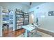 Bright office space with hardwood floors, a bookshelf, and a modern desk setup at 1111 Normandy Trace Rd # 1111, Tampa, FL 33602