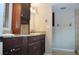 Bathroom with double sinks, granite countertops, and tile flooring at 11141 Rex Hunter Ln, Lithia, FL 33547