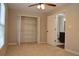This bedroom has a ceiling fan, carpeting and walk in closet at 11141 Rex Hunter Ln, Lithia, FL 33547
