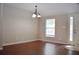 Dining room with hardwood floors and chandelier lighting at 11141 Rex Hunter Ln, Lithia, FL 33547