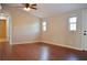 Spacious living room with dark wood floors and plenty of natural light at 11141 Rex Hunter Ln, Lithia, FL 33547