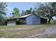 Outbuilding featuring barn doors and metal roof at 11141 Rex Hunter Ln, Lithia, FL 33547