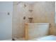 Shower features travertine tile and a built in niche at 11141 Rex Hunter Ln, Lithia, FL 33547