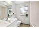 Bright bathroom featuring white sink, toilet, bathtub and natural light at 11409 Spring Hill Dr, Spring Hill, FL 34609