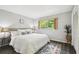 Bright bedroom with wood-look floors, natural light and stylish decor at 11409 Spring Hill Dr, Spring Hill, FL 34609