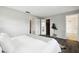 Bright bedroom with walk-in closet, bathroom access, wood-look floors, and plant at 11409 Spring Hill Dr, Spring Hill, FL 34609