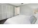 Bright bedroom with wood-look floors and large closet at 11409 Spring Hill Dr, Spring Hill, FL 34609
