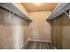 Spacious closet with wood paneling and shelving; plenty of storage space at 11409 Spring Hill Dr, Spring Hill, FL 34609