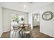 Dining area with tile flooring and a wooden table near the kitchen; great for casual dining and entertaining at 11409 Spring Hill Dr, Spring Hill, FL 34609