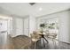 Cozy dining area with tiled floors and a sliding glass door leading to the patio; seats four at 11409 Spring Hill Dr, Spring Hill, FL 34609