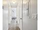 Hallway features tile flooring, clean white doors and trim, and access to rooms at 11409 Spring Hill Dr, Spring Hill, FL 34609