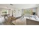 Bright living room with lots of natural light, neutral color palette, and a comfortable seating area with stylish decor at 11409 Spring Hill Dr, Spring Hill, FL 34609