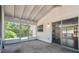 A view of the screened porch showcasing a serene view of natural light at 11409 Spring Hill Dr, Spring Hill, FL 34609
