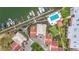 Aerial view featuring boat docks, community pool, and hot tub provides a snapshot of resort living at 120 1St E St # 104, St Petersburg, FL 33715