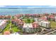 Breathtaking aerial view of a waterfront community with lush landscaping, pools, and boat docks at 120 1St E St # 104, St Petersburg, FL 33715