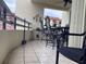 Relax on this balcony with tile flooring, outdoor furniture, and delightful decorative pieces at 120 1St E St # 104, St Petersburg, FL 33715