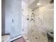 Luxurious shower with glass enclosure, marble tile, and multiple shower heads at 120 1St E St # 104, St Petersburg, FL 33715