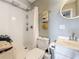 Bathroom with white shower and vanity featuring beach-themed decor and decorative towels at 120 1St E St # 104, St Petersburg, FL 33715