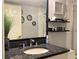 This bathroom is decorated with tasteful nautical decor and contains granite countertops at 120 1St E St # 104, St Petersburg, FL 33715