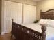 This spacious bedroom features a wooden bed frame and two sets of closets at 120 1St E St # 104, St Petersburg, FL 33715