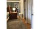 Bedroom featuring wood floors, a plush rug, and a view of an adjacent room at 120 1St E St # 104, St Petersburg, FL 33715